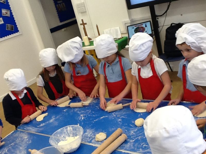 Rolling our bread dough.